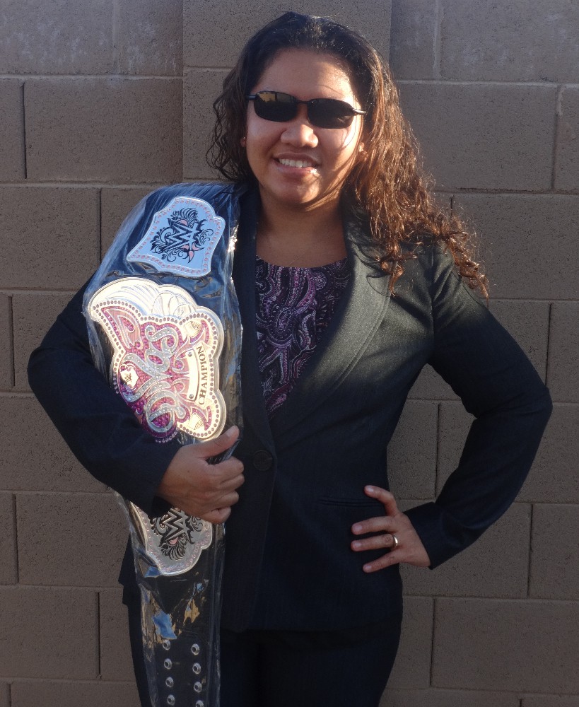 picture of sehana with wwe diva's belt over her shoulder